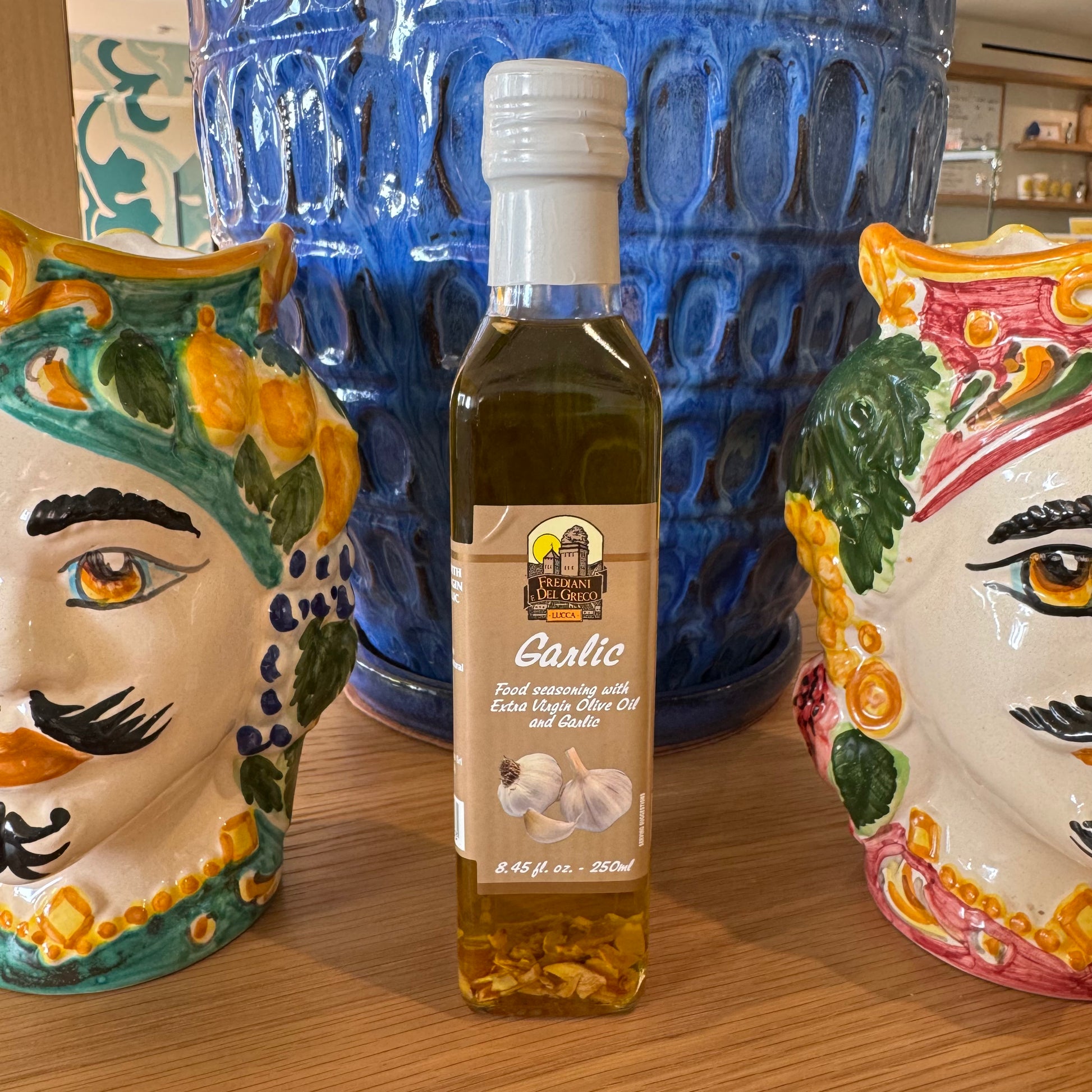 Garlic-infused extra virgin olive oil 250ml – for Mediterranean flavor in dishes.